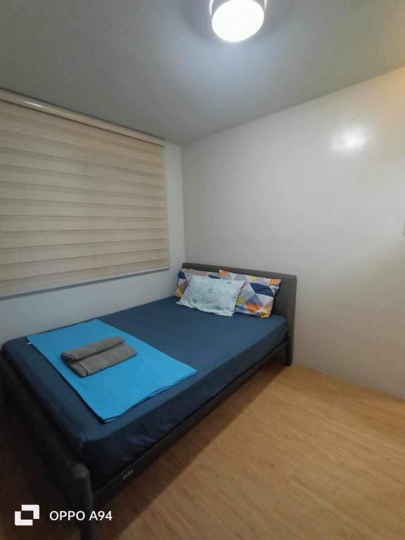 Postel nebo postele na pokoji v ubytování One Oasis Davao Condo 2BR Behind SM Mall with WIFI & Pool