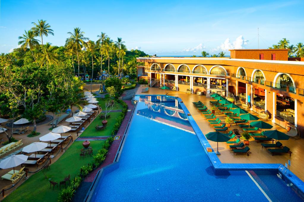 an overhead view of a resort with a swimming pool at Araliya Beach Resort & Spa Unawatuna- Where you meet the sea all year in Unawatuna