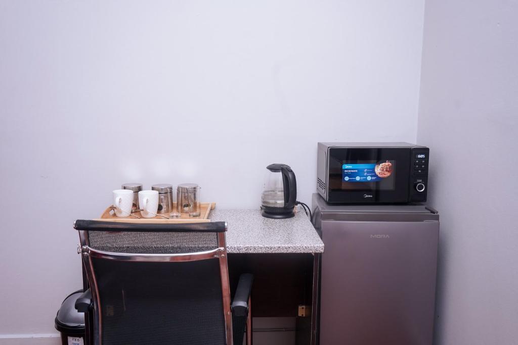 TV a/nebo společenská místnost v ubytování Safi Suites and Conference Centre