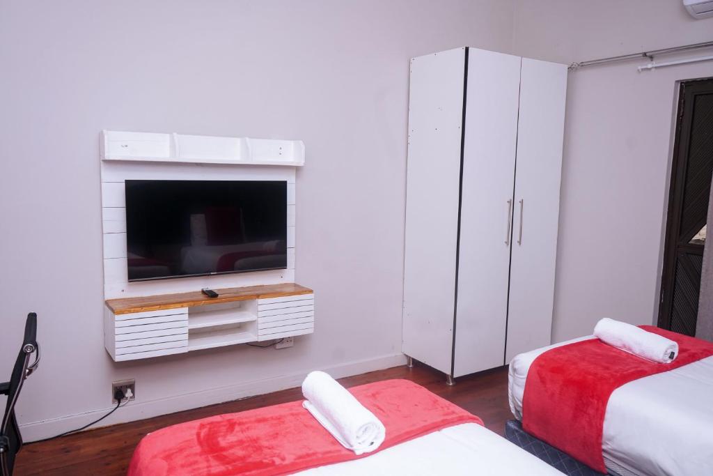 Postel nebo postele na pokoji v ubytování Safi Suites and Conference Centre