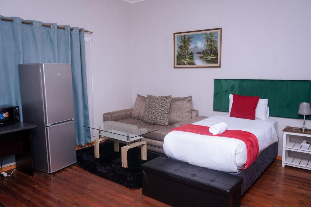 Postel nebo postele na pokoji v ubytování Safi Suites and Conference Centre