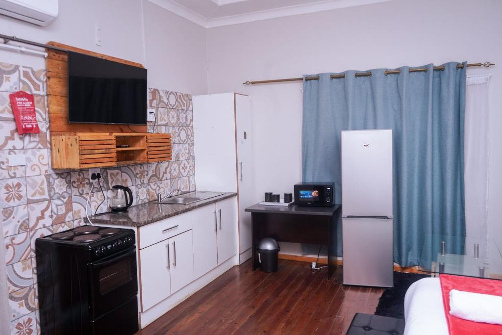Kuchyň nebo kuchyňský kout v ubytování Safi Suites and Conference Centre