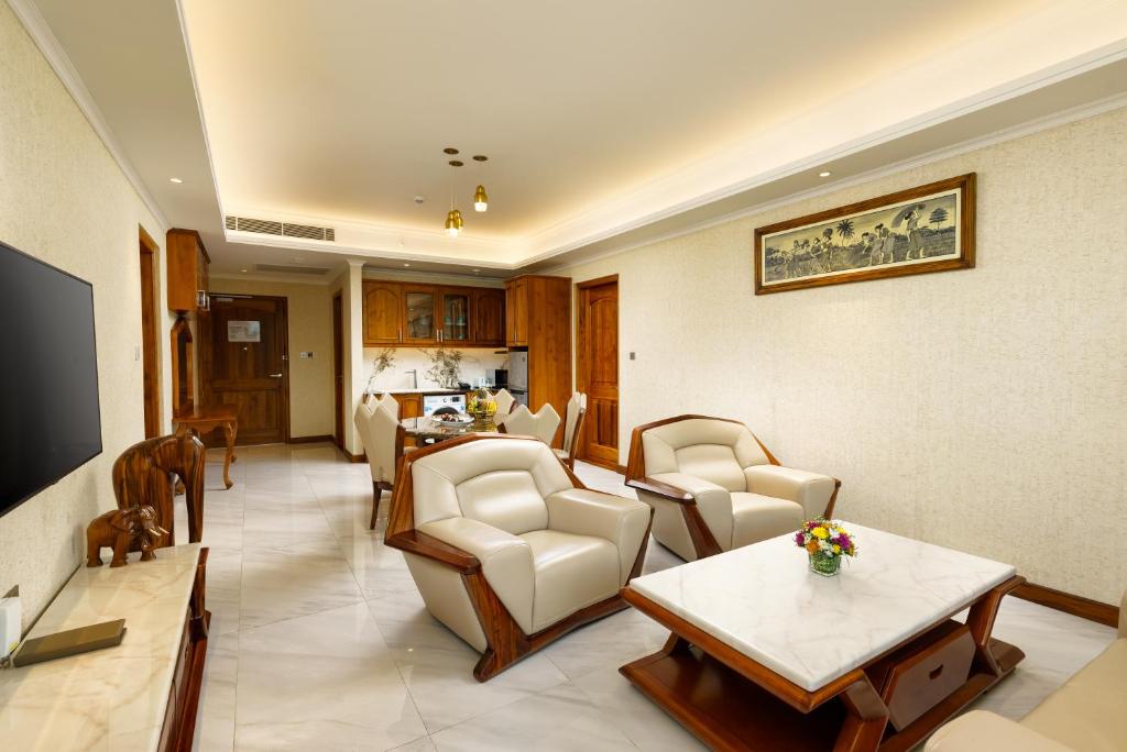 a living room with a couch and chairs and a table at Araliya Beach Resort & Spa Unawatuna- Where you meet the sea all year in Unawatuna