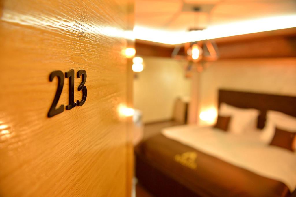 Postel nebo postele na pokoji v ubytování Restaurant & Apartments & Rooms AVENIA
