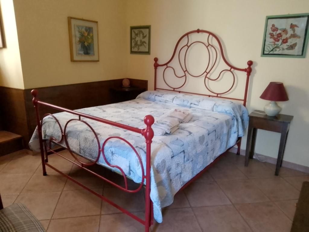 Postel nebo postele na pokoji v ubytování B&B Le Buche Casa Storica