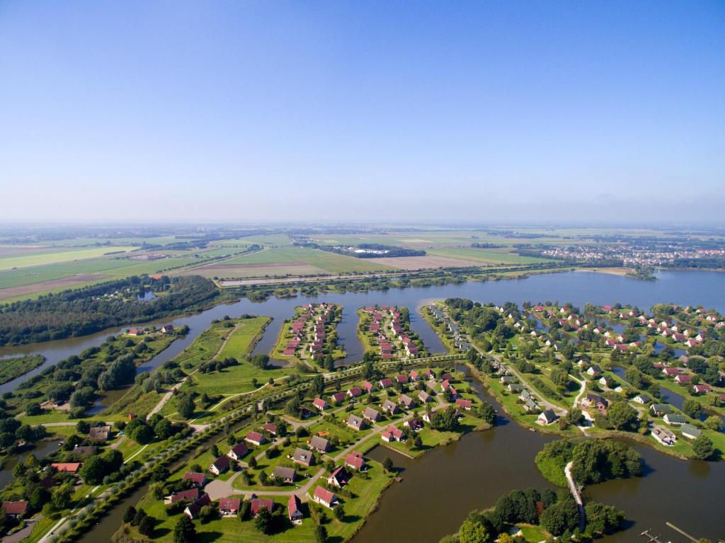 an aerial view of a park next to a river at Center Parcs Sandur Emmen in Emmen