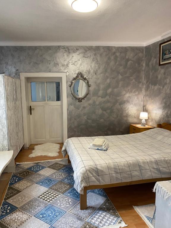 a bedroom with two beds and a mirror on the wall at Comaniciu Sorin in Făgăraş