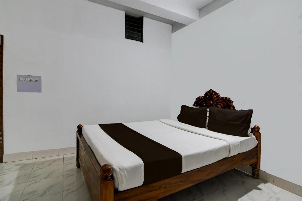 Postel nebo postele na pokoji v ubytování OYO 82217 SS International
