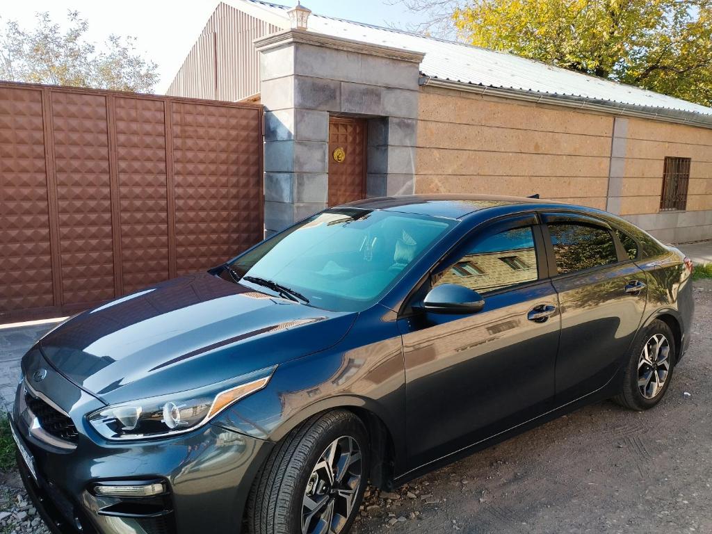 a small car parked in front of a building at Armenia Home in Pʼarakʼar