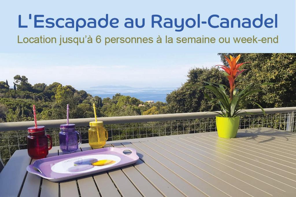 a tray of food on a table on a balcony at Villa l'Escapade in Rayol-Canadel-sur-Mer