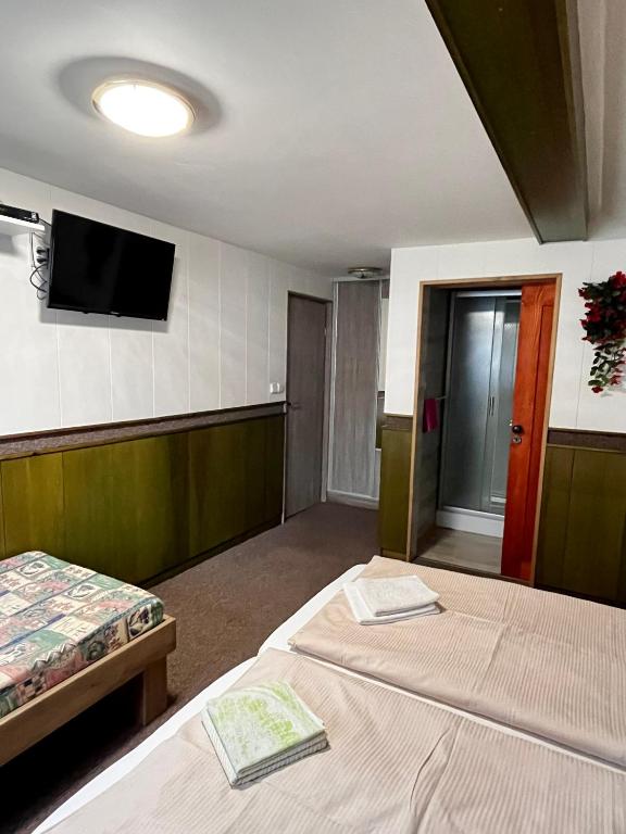 Postel nebo postele na pokoji v ubytování Penzion U Zemánků