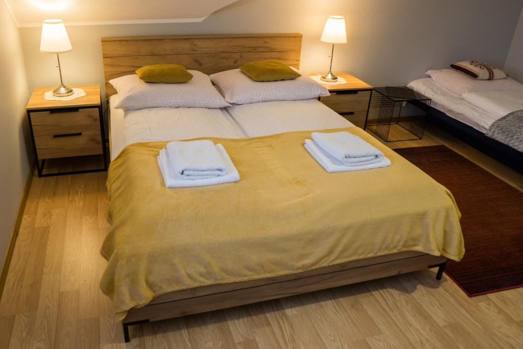 Posteľ alebo postele v izbe v ubytovaní Apartament Jodłowy