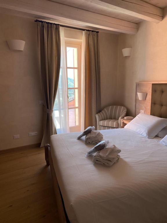 Postel nebo postele na pokoji v ubytování Agriturismo Costa di Faraggiana