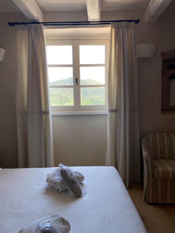 Postel nebo postele na pokoji v ubytování Agriturismo Costa di Faraggiana