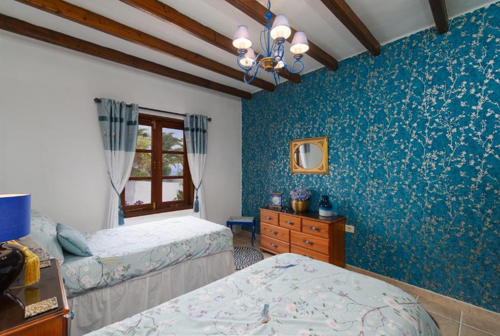 Postel nebo postele na pokoji v ubytování Villa Dune