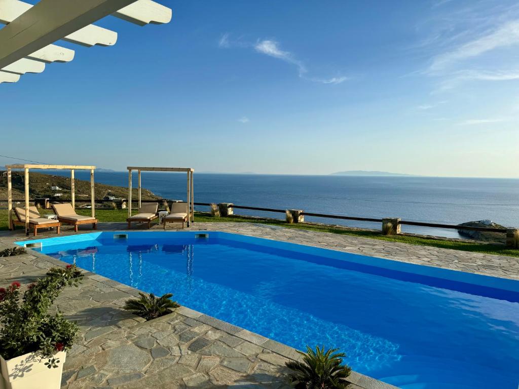 a swimming pool with a view of the ocean at Charakas Horizon in Gavrion
