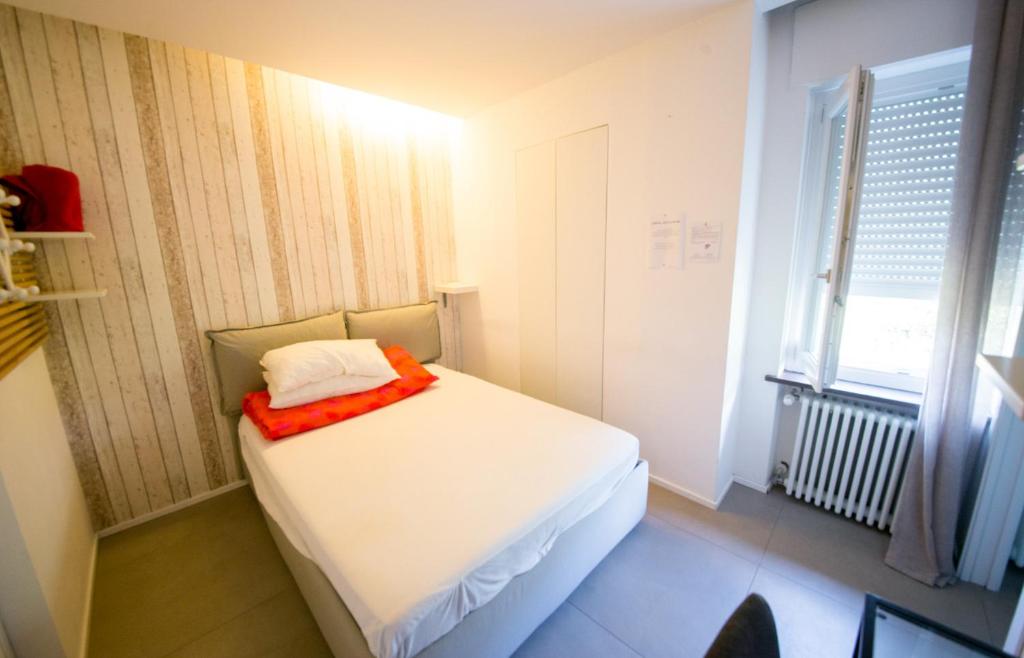 Postel nebo postele na pokoji v ubytování SMILE ACCOMODATION AOSTA