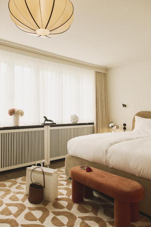 Postel nebo postele na pokoji v ubytování Hotel Bella Grande