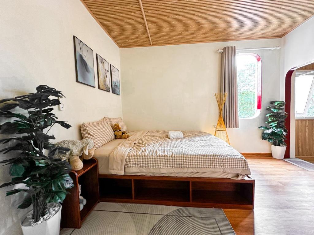 Postel nebo postele na pokoji v ubytování La Casa Di Dicembre 36B Trần Hưng Đạo