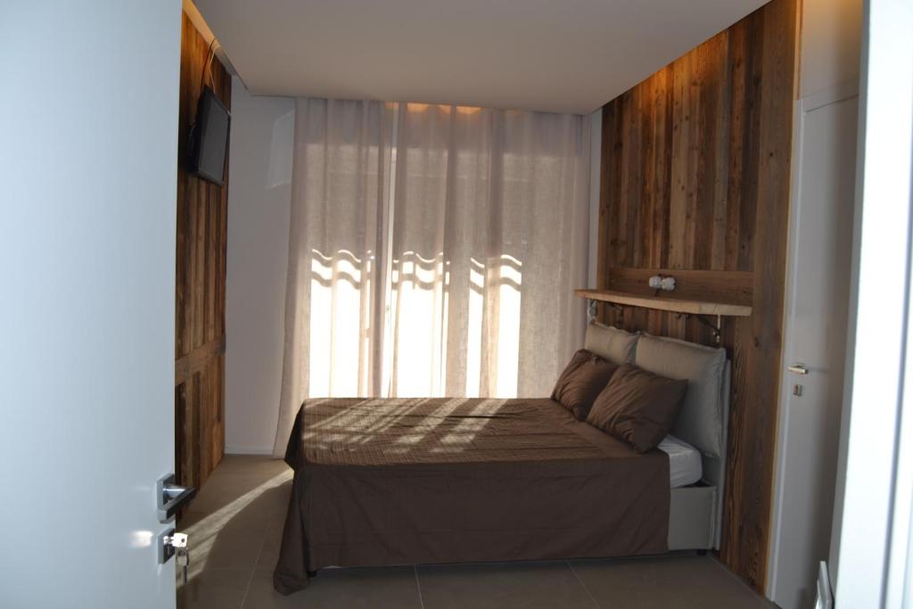 Postel nebo postele na pokoji v ubytování SMILE ACCOMODATION AOSTA