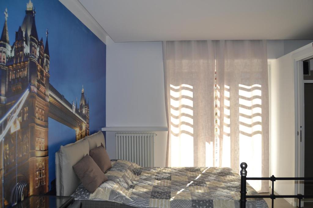 Postel nebo postele na pokoji v ubytování SMILE ACCOMODATION AOSTA
