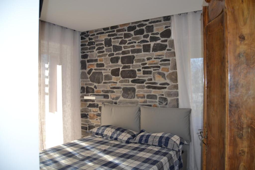 Postel nebo postele na pokoji v ubytování SMILE ACCOMODATION AOSTA