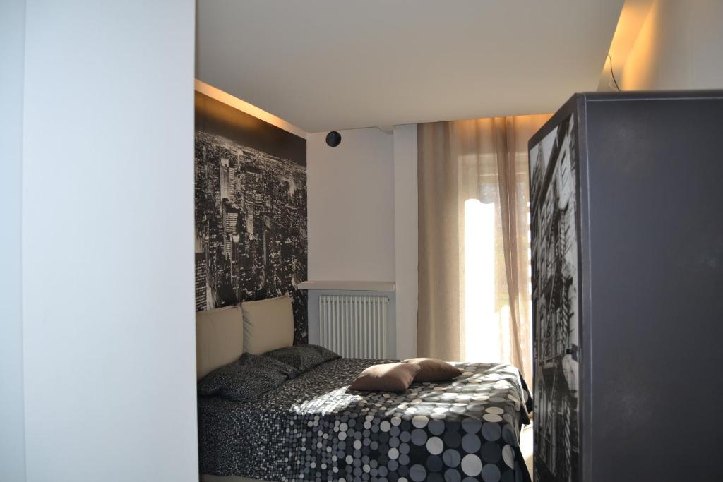 Postel nebo postele na pokoji v ubytování SMILE ACCOMODATION AOSTA