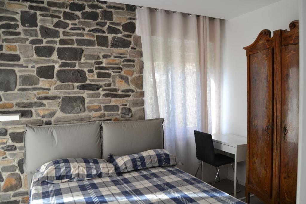 Postel nebo postele na pokoji v ubytování SMILE ACCOMODATION AOSTA