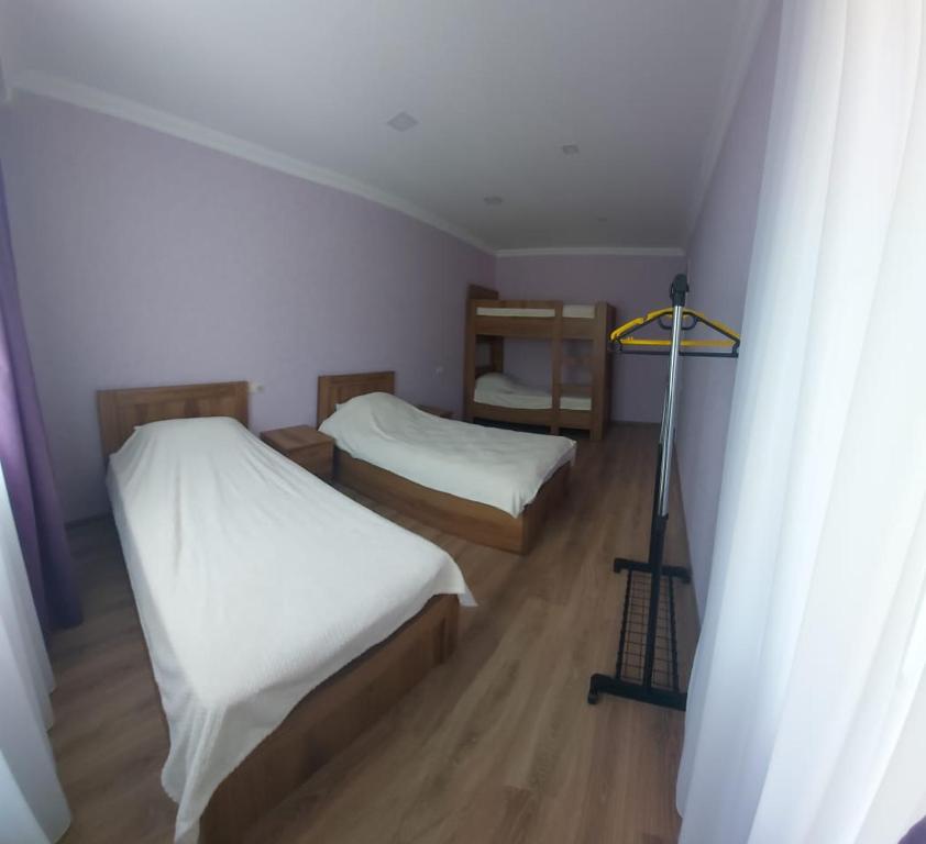 Postel nebo postele na pokoji v ubytování M7 House