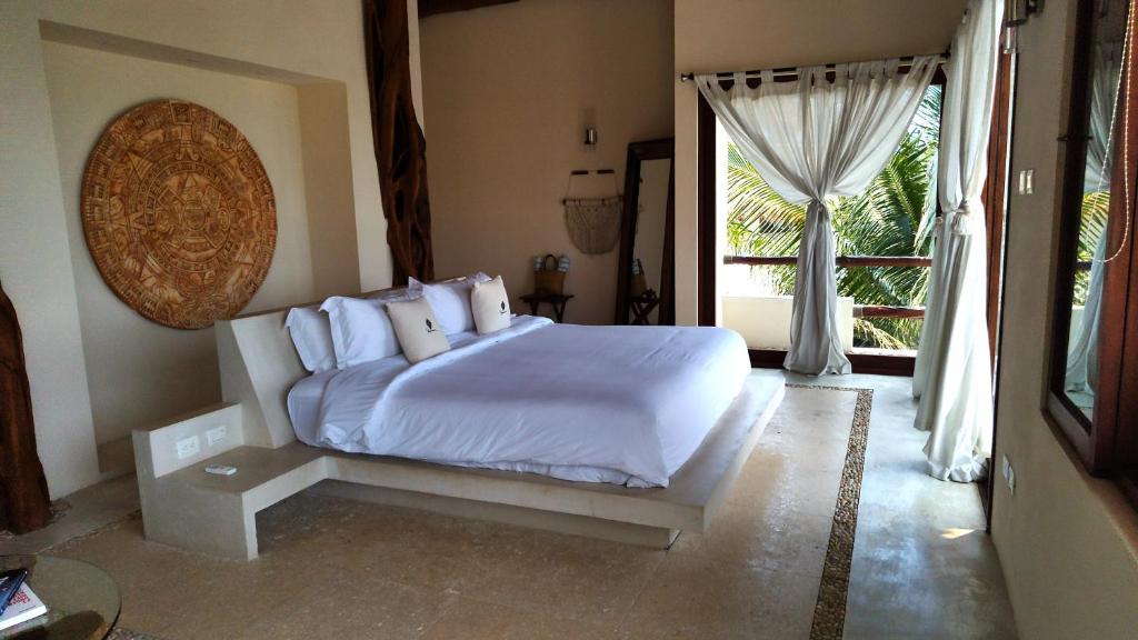 Un ou plusieurs lits dans un hébergement de l'établissement Casa Punta Coco & Beach Club