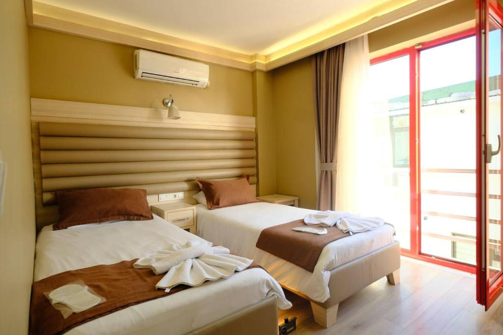 Postel nebo postele na pokoji v ubytování al khalej otel