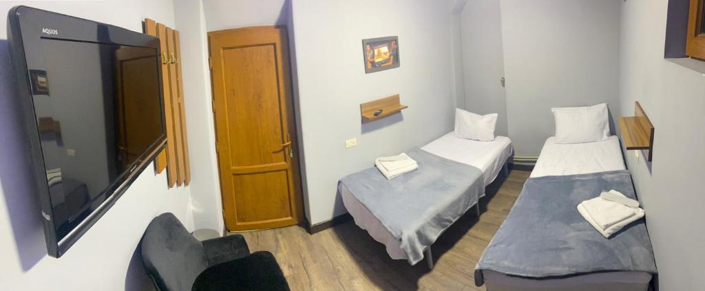 Postel nebo postele na pokoji v ubytování ENIGMA HOSTEL