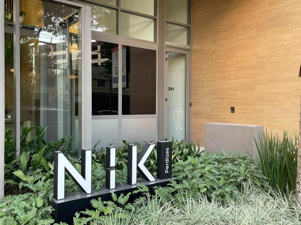 a nike sign in front of a building at Nik Perdizes - Studios por temporada in Sao Paulo