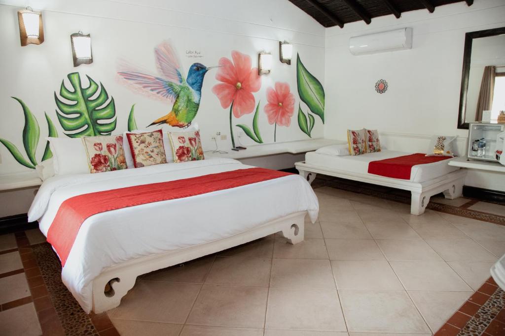 Postel nebo postele na pokoji v ubytování Hotel Portón del Sol