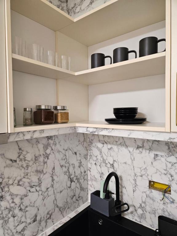 Kuchyň nebo kuchyňský kout v ubytování Studio apartman Gold