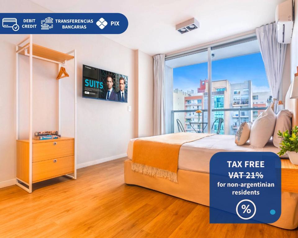 a room with a bed and a window with a tv at Modern Apartments in Palermo Soho in Buenos Aires
