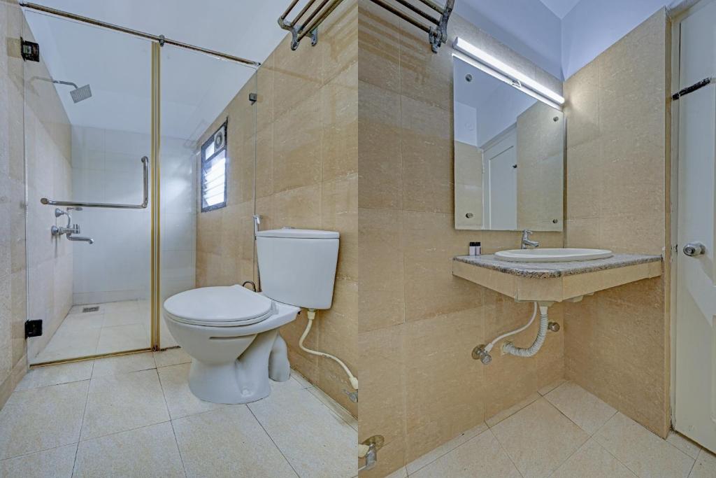 uma casa de banho com um WC, um chuveiro e um lavatório. em Super Collection O Planet Grande By Elite Hospitality em Chennai