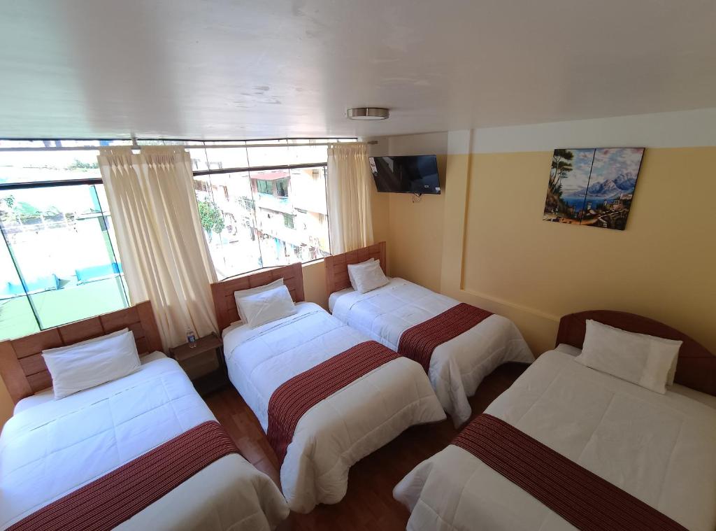 Postel nebo postele na pokoji v ubytování INTI WAYRA MACHUPICCHU
