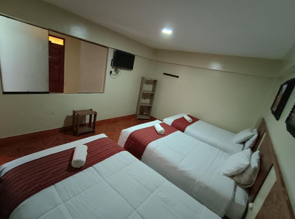 Postel nebo postele na pokoji v ubytování INTI WAYRA MACHUPICCHU