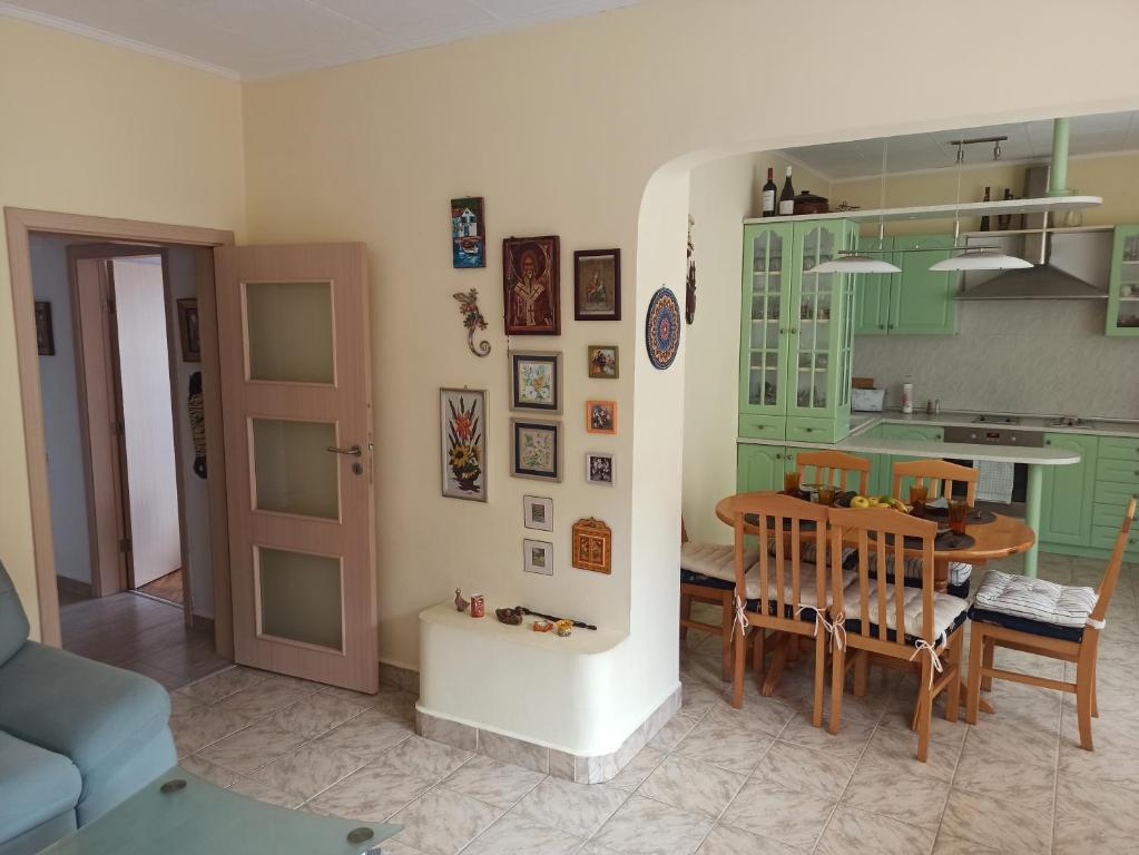 a kitchen and dining room with a table and chairs at Apartment Maddie in Teteven