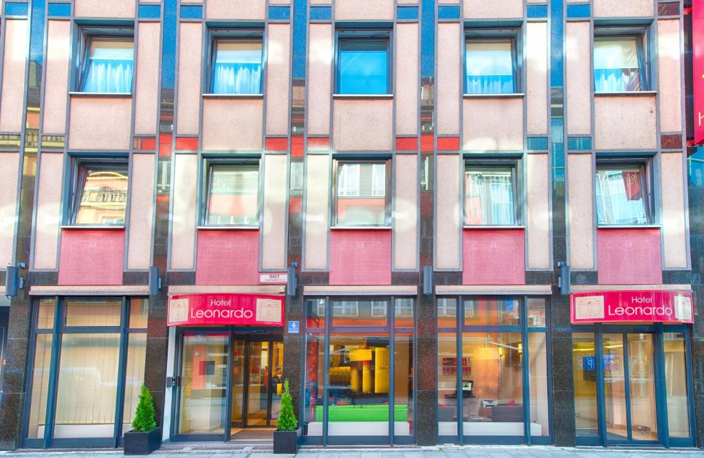 a facade of a building with a lot of windows at Leonardo Hotel München City Center in Munich