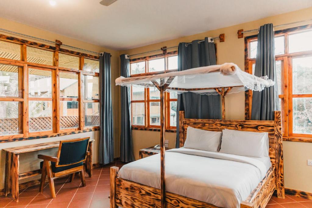 Postel nebo postele na pokoji v ubytování Forest Sunset Hotel