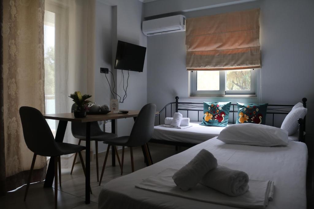 Posteľ alebo postele v izbe v ubytovaní Michaelangelo Apartments