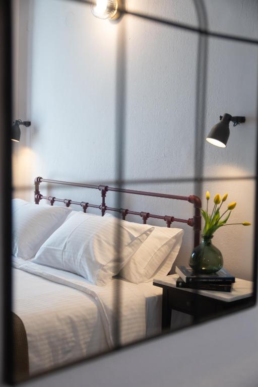 Postel nebo postele na pokoji v ubytování Acropolis Hotel