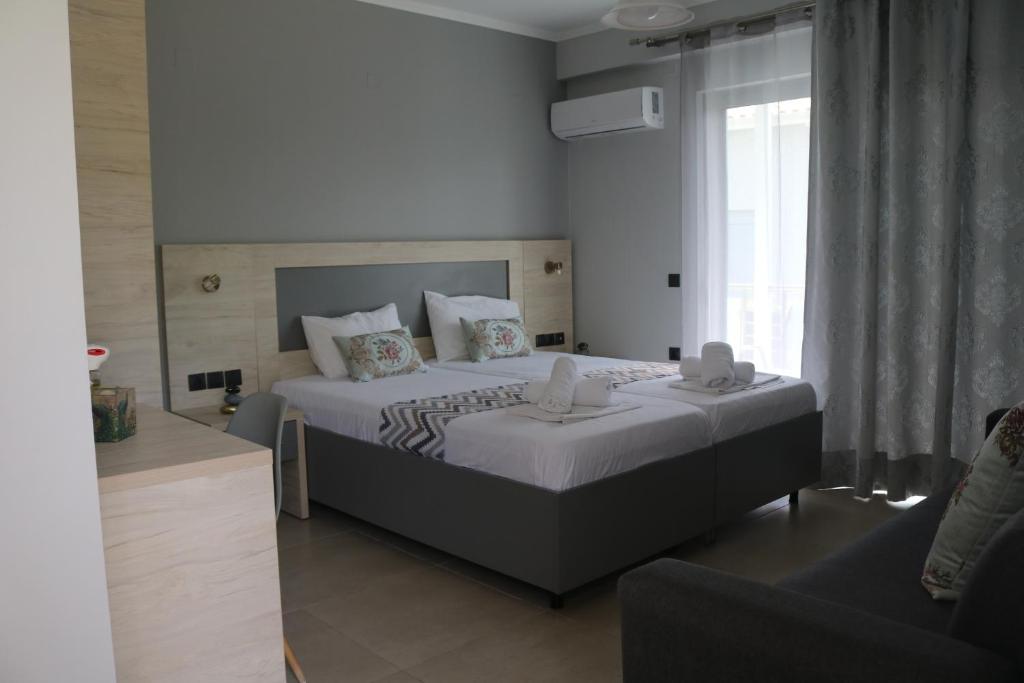 Posteľ alebo postele v izbe v ubytovaní Michaelangelo Apartments