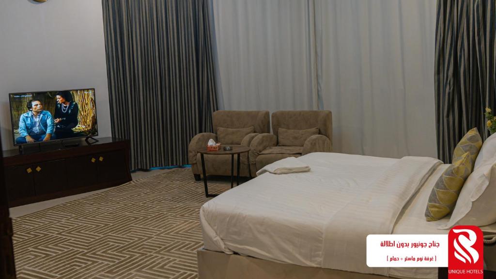 TV a/nebo společenská místnost v ubytování Al Andalus Tolen Hotel