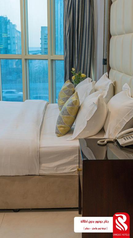Postel nebo postele na pokoji v ubytování Al Andalus Tolen Hotel