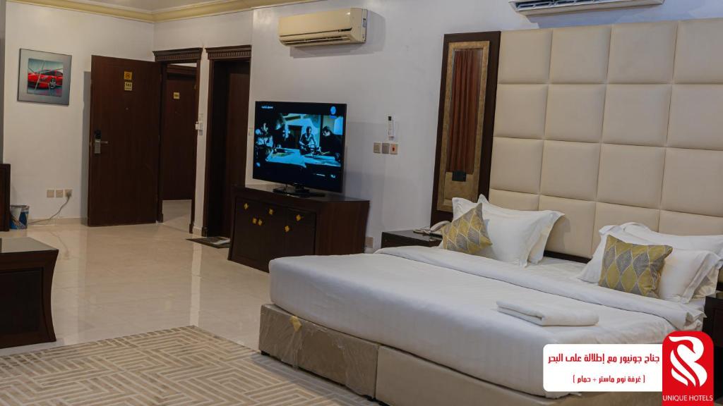 TV a/nebo společenská místnost v ubytování Al Andalus Tolen Hotel