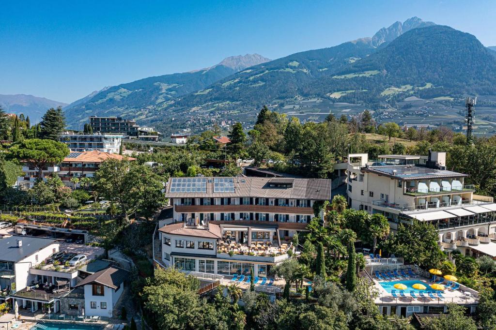 an aerial view of a resort with mountains in the background at Hotel Bellevue in Tirolo