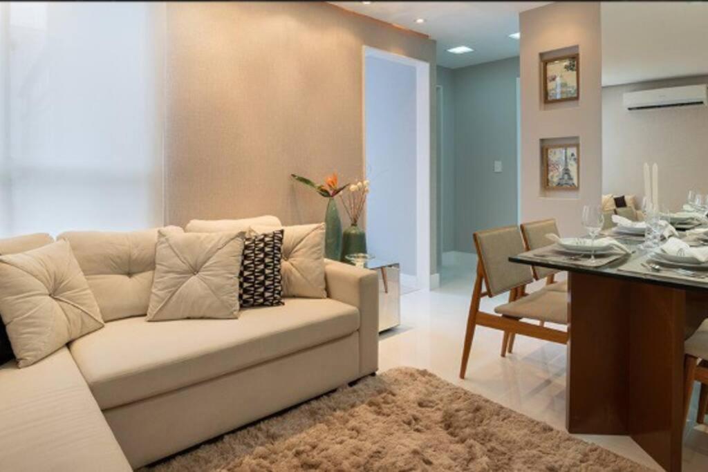 a living room with a couch and a table at Apartamento Completo - Alto Padrão - Sta Cruz in Rio de Janeiro